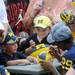 Young Michigan fans wait for an autograph from defensive back Ross Douglas during youth day at Michigan Stadium on Sunday, August 11, 2013. Melanie Maxwell | AnnArbor.com